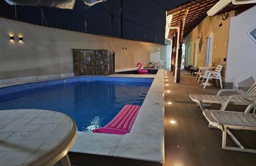 Jardim Real House | Casa Lindíssima e Espaçosa com 2 Piscinas - Adulto e Infantil, Perto da Praia, Opção da Piscina Adulto Aquecida Cobrado à Parte, 4 Quartos Frente as Piscinas, Área Gourmet Completa com Churrasqueira, Forno e Fogão a Lenha, Mesa de Bilhar, Lareira na Sala