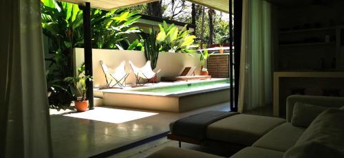 Carmen Villa | Casa Remy - Walk to the Beach and stay in a private compound! Pool, Kitchen, AC, Wi-Fi