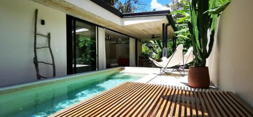 Carmen Villa | Casa Remy - Walk to the Beach and stay in a private compound! Pool, Kitchen, AC, Wi-Fi