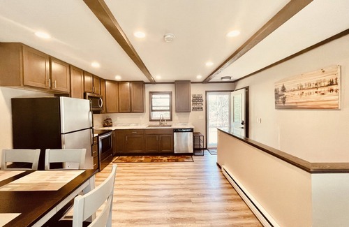 Lake Shore Estates House | Castle Rock Lakefront Home, with pier, sand bottom, and wrap around deck