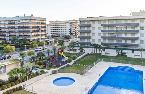 La Pineda Apartment | Central Apartment in La Pineda with Pool, Garden, and Playground