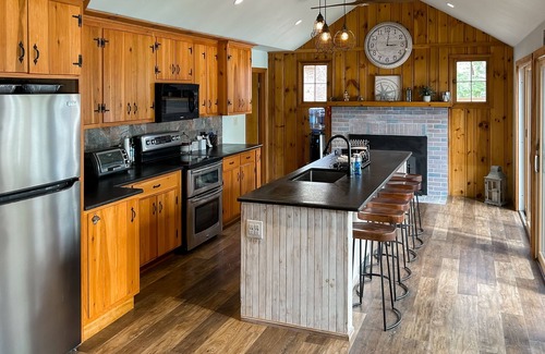 Pine River Pond House | Central lakefront house with private hot tub, dock, patio bar, & beach access