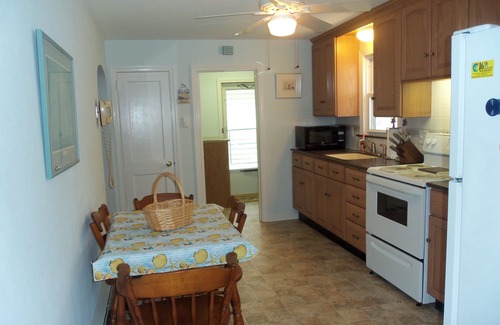 North End House | Centrally located near downtown shopping and restaurants and just a short walk to the beach and boardwalk. Large rear parking pad for 4 cars, picnic table and a fun basketball net in back too!