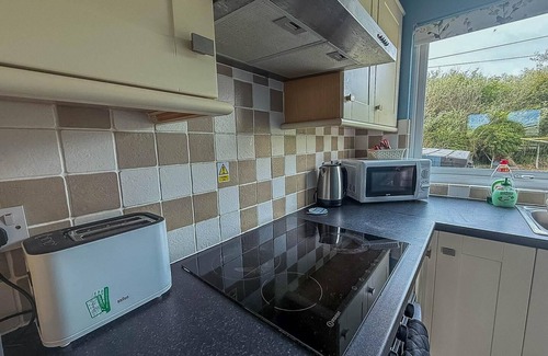 Bacton Ski Chalet | Chalet for hire at Rainbows End near a beautiful Norfolk beach ref 31039R