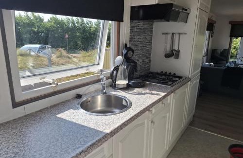 Buren Ski Chalet | Chalet Inn Ameland inclusief Fietsen, Zee en Strand op loopafstand!