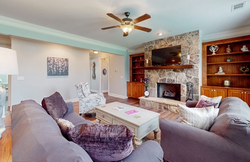 Riverwood Plantation House | Champions Retreat | Dog-friendly home with fireplace, grill, and sunny patio