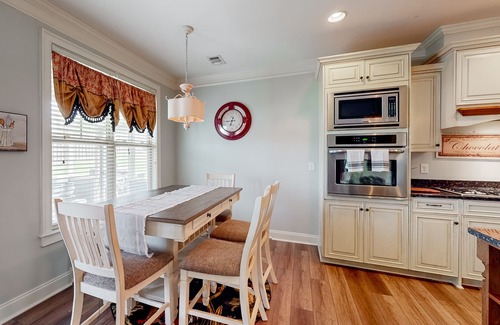 Riverwood Plantation House | Champions Retreat | Dog-friendly home with fireplace, grill, and sunny patio