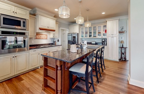 Riverwood Plantation House | Champions Retreat | Dog-friendly home with fireplace, grill, and sunny patio