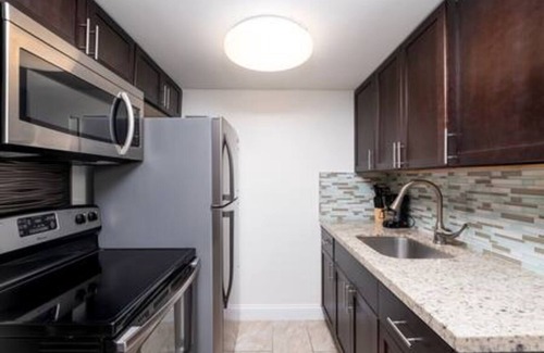 Coral Heights Apartment | Charlie Chaplin - A Timeless Modern Escape!