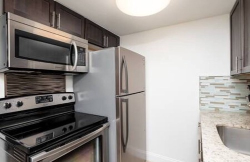 Coral Heights Apartment | Charlie Chaplin - A Timeless Modern Escape!
