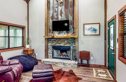 Waller Cabin | Charming cabin with hot tub, full kitchen, firepit, deck, grill, & W/D
