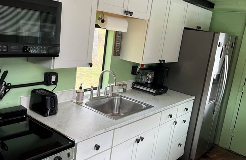 Freedom Bed & Breakfast | Charming Caboose-turned-tiny home on lake