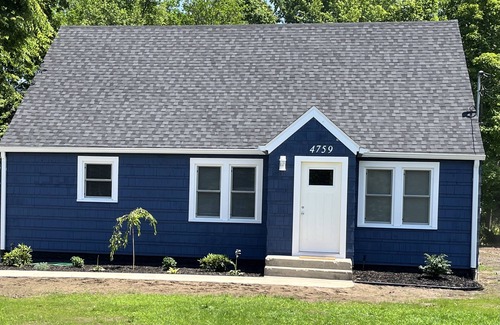 Coloma Cottage | Charming Cape Cod House Minutes From Paw Paw Lake, Wineries, and Wedding Venues