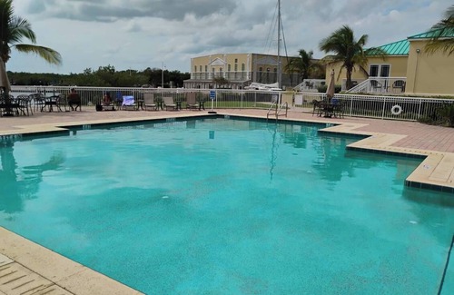 Key West Boat Rental | Charming catamaran sailboat with AC, pool in stock island yacht club, Key West.