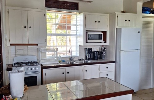 Cap Estate Cottage | Charming Cottage Located In Cap Estate - Orchid Cottage 1 Bedroom Home by RedAwning