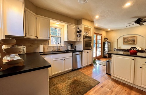 Golden House | Charming English Tudor nestled under South Table Mesa