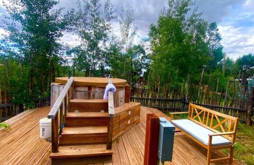 San Cristobal House | Charming Log Cabin Rental on Eco-Farm near Taos Ski Valley