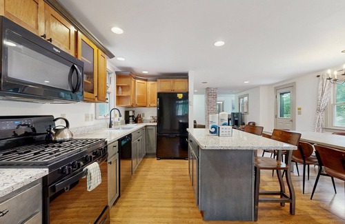 Sunday River Area Ski Chalet | Charming mountain chalet with a hot tub, fire pit, and room for the whole family