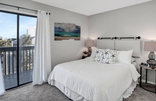 Neptune Beach Condo | Charming ocean view condo with kitchen, balcony & beach towels - close to beach