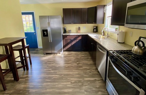 Rochester House | Charming remodeled 3 bedroom. Near RIT & U of R. Free on-site parking.
