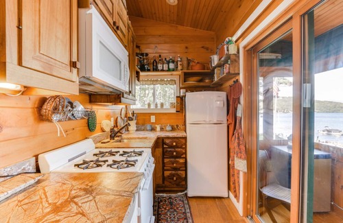Laconia Cottage | Charming waterfront cottage at Weirs Beach with shared dock and WifI