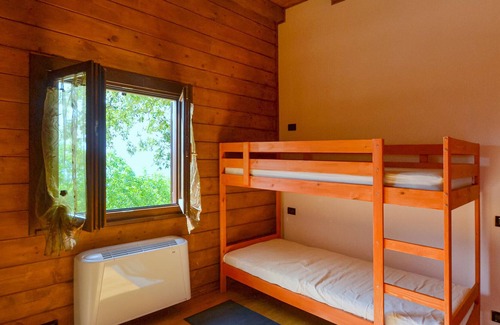 Pieve Santo Stefano House | Charming wooden house, situated on a hill, between Florence and San Marino.