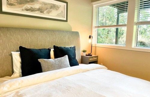 Caulfeild House | Cheerful master bedroom in Cedar Woods!