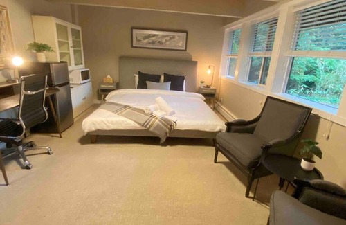 Caulfeild House | Cheerful master bedroom in Cedar Woods!