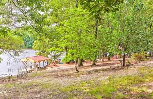 South Carolina Lakes & Blackwater Rivers Cottage | Cheery Swansea Home on Calmont Pond w/Dock!