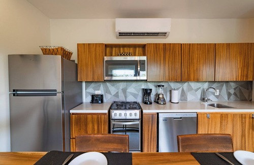P Chahue Condo | Chic Central Living: 1-Bedroom Condo Rental in Prime Location