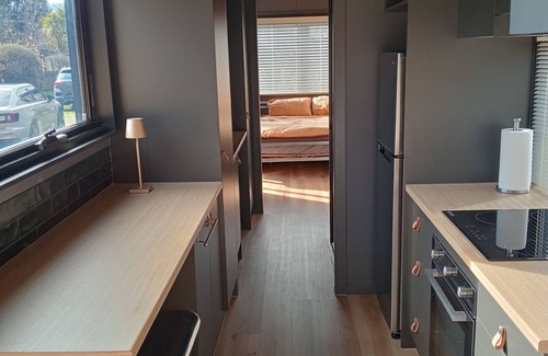 Waitahanui Apartment | Chic modern shipping container a short stroll from Lake Taupo/Waitahanui River.