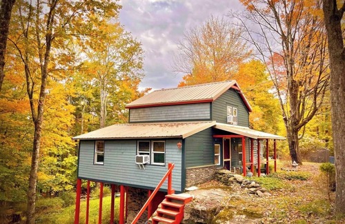 Smallwood Cabin | Chic Treehouse Cabin with Pedal Boat, Hot Tub, BBQ, Fire Pit, SUPs, & Lake Access