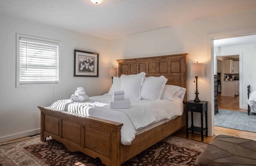 Hendersonville Cottage | Classic white farmhouse style cottage. Perfect for a serene country getaway.