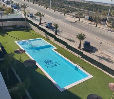 Els Arenals del Sol Apartment | Claudia Luxury Apartment near the beach with a pool, gym, and secure gated parking