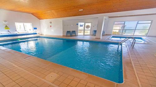 Putsborough Apartment | Clifton Court Apt 16 with Indoor Heated Pool & Sea Views