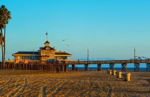 Downtown Village House | Close to Huntington Beach! Lounge by the Outdoor Pool, Pets Allowed!