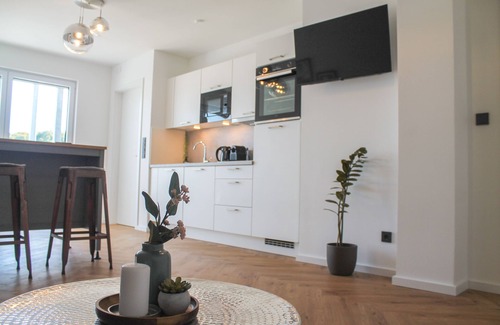 Rauental Apartment | Close to the city center with parking space, balcony, lockable bike box & charging station