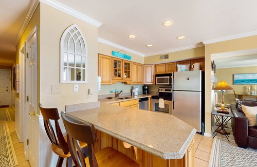 Caine Woods Condo | Coastal and Beachy Condo with Pool and Hot tub access - steps from beach