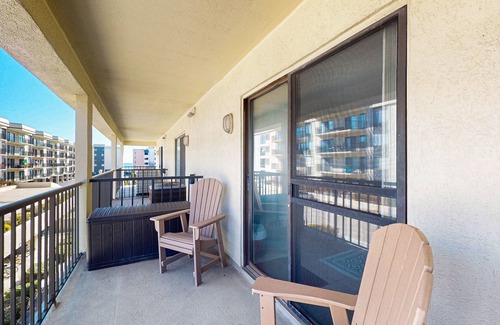 Caine Woods Condo | Coastal and Beachy Condo with Pool and Hot tub access - steps from beach