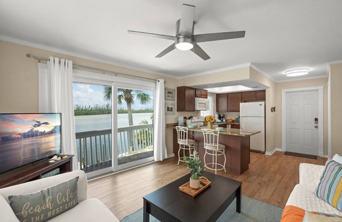 Siesta Key Condo | Coastal Breeze Siesta: Waterfront 4-Unit Retreat – Walk to Turtle Beach, Boat Dock & Free Beach Gear