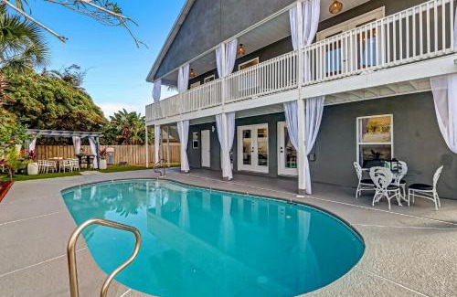 Vilano Beach House | Coastal Cabana Heated Pool Walk to Beach