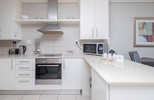 Lagoon Beach Apartment | Coastal Escape with Stunning Mountain Backdrop
