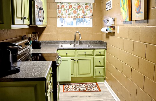 Cobb Cabin | Colorful lakefront home with private dock, scenic porch, washer/dryer, & AC