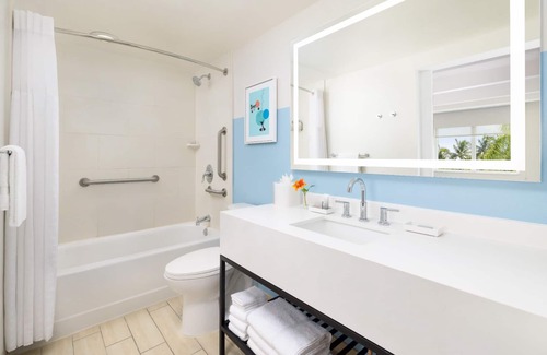 New Town Hotel | Colorful Stay at Blue Flamingo | Poolside Bar, Lawn Games, Music & Fire Pits