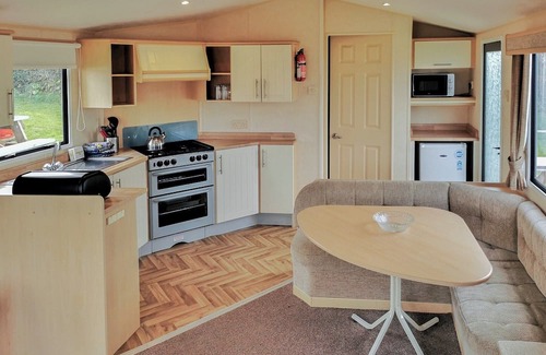 Narberth House | Comfortable and spacious 12ft-wide caravan with one double and two twin.