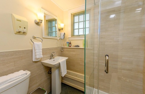 Stowe Bed & Breakfast | Comfortable budget room with queen bed, a stunning view of Mount Mansfield, and all-glass shower stall with full service breakfast included