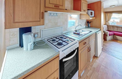 Llanllwchaiarn House | Comfortable caravan with one double and two twin.