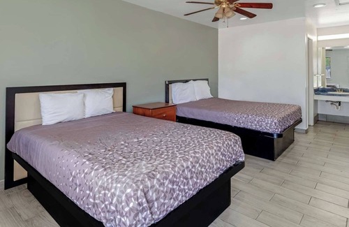 Eastside Promise Neighborhood Hotel | Comfortable Room w/Complimentary Breakfast - Perfect for a Restful Stay