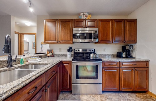 Lincoln Condo | Comfy condo with spacious deck, fast WiFi, fireplace, indoor & outdoor pools