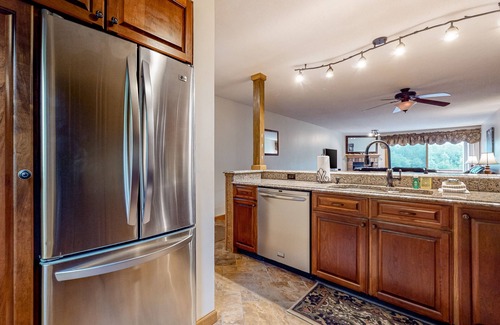 Lincoln Condo | Comfy condo with spacious deck, fast WiFi, fireplace, indoor & outdoor pools